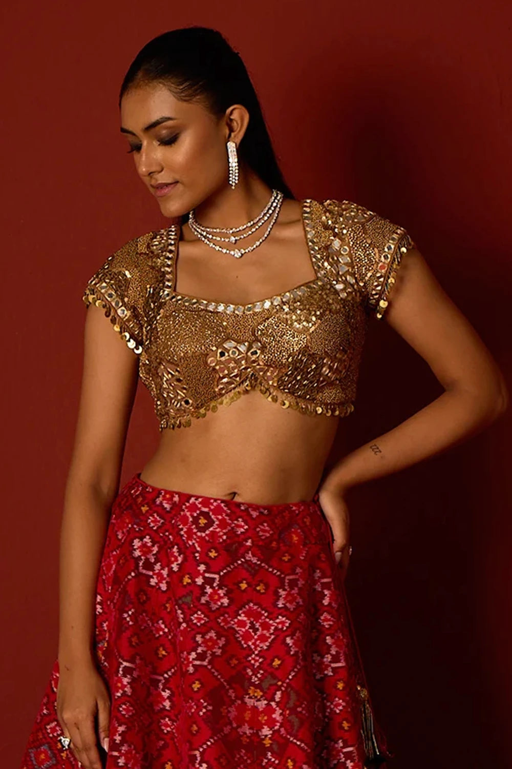 Red Patola Lehanga with Gold Embellished Blouse and Dupatta