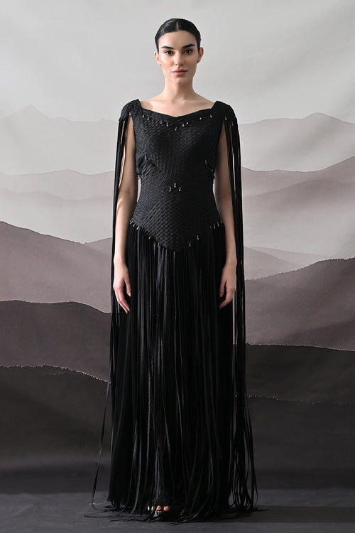 Black Gown With Silhouette Defined By Texture And Movement