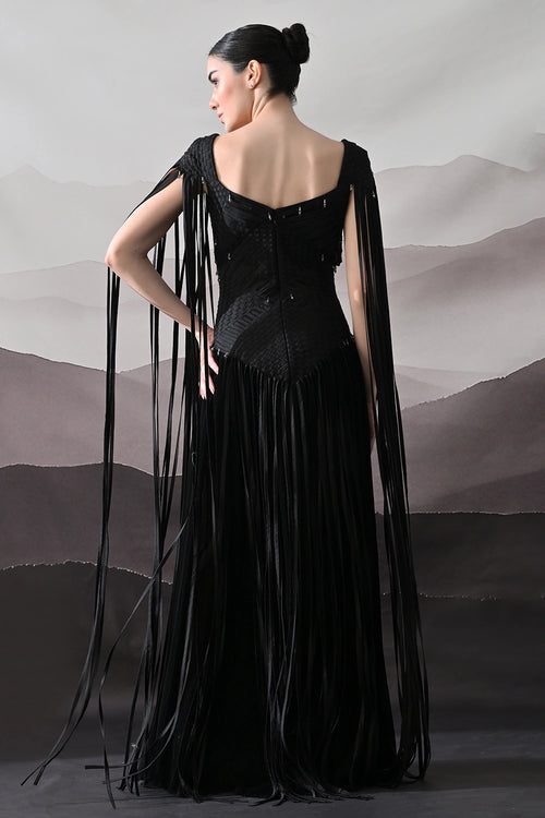 Black Gown With Silhouette Defined By Texture And Movement
