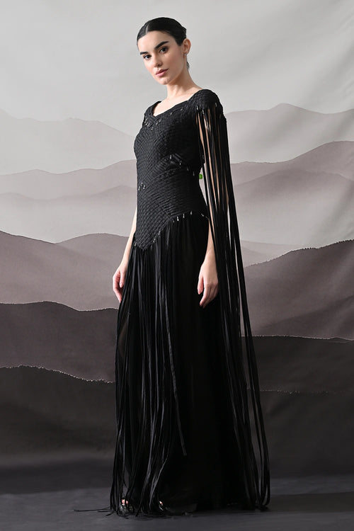 Black Gown With Silhouette Defined By Texture And Movement