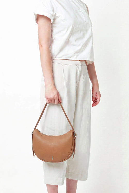 Ina Pebble Tan Crescent Crossbody Bag