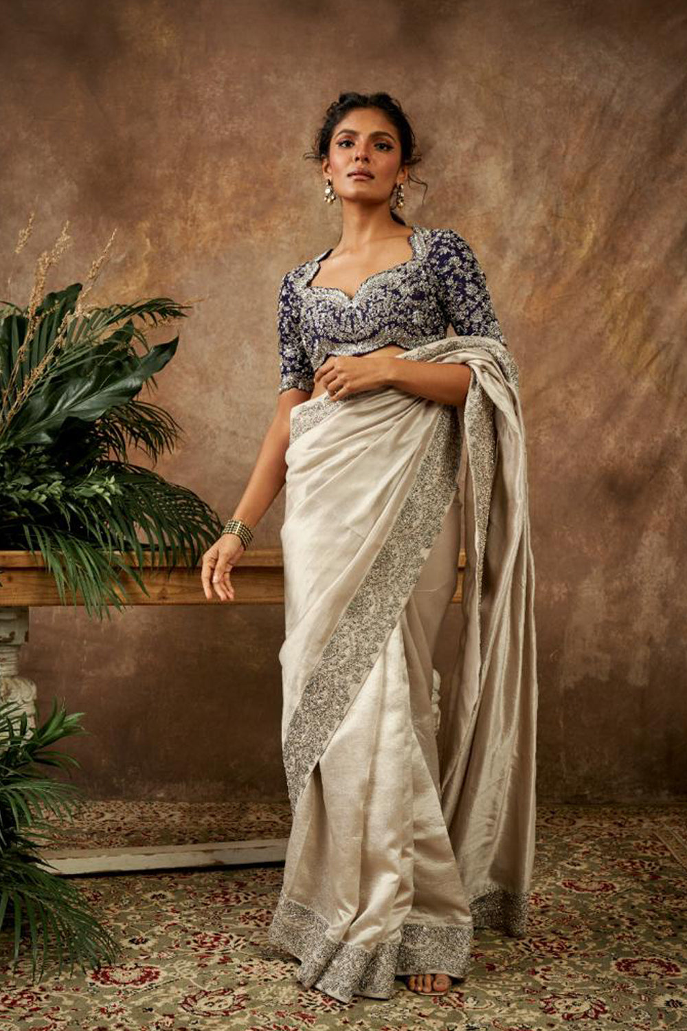 Beige Embroidered Saree and Purple Blouse